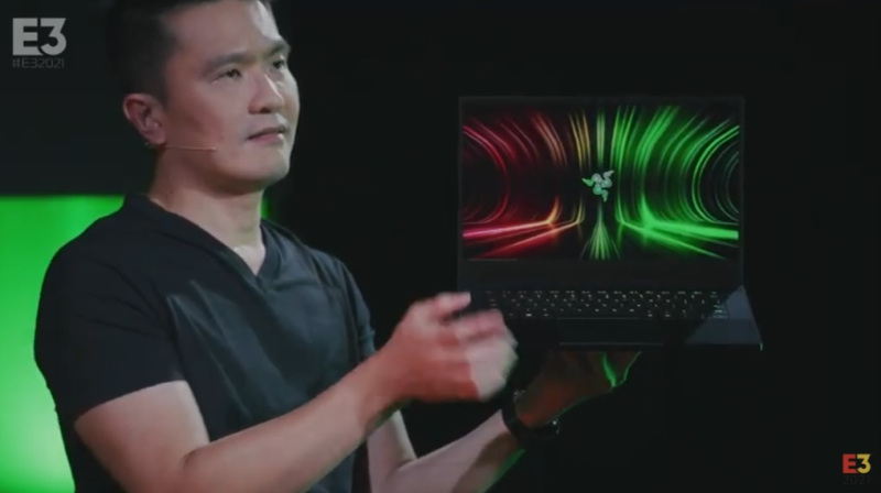 Min-Liang Tan holds the Razer Blade 14 with an AMD processor and Nvidia GeForce 3080 RTX graphics.